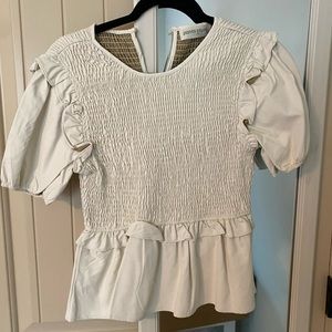 Pants Store Boutique peplum top. White faux leather size large
